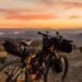 orange and black off-road bicycle on hill